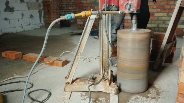 istock The powerful drill with a diamond tip drills holes for making communications in the house 1130055858