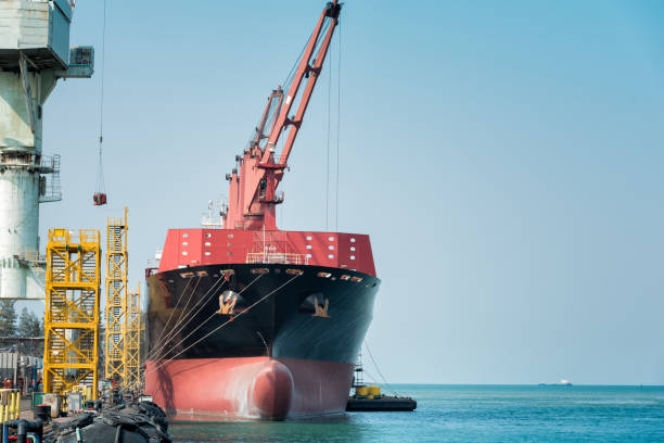 istock ship berthing alongside in the dock yard terminal for repairing in shipyard 1130057136