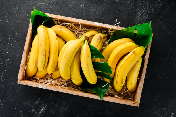 istock Fresh bananas in a wooden box. Top view. Free copy space. 1130058734