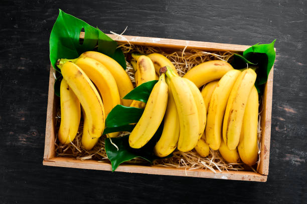 istock Fresh bananas in a wooden box. Top view. Free copy space. 1130058802