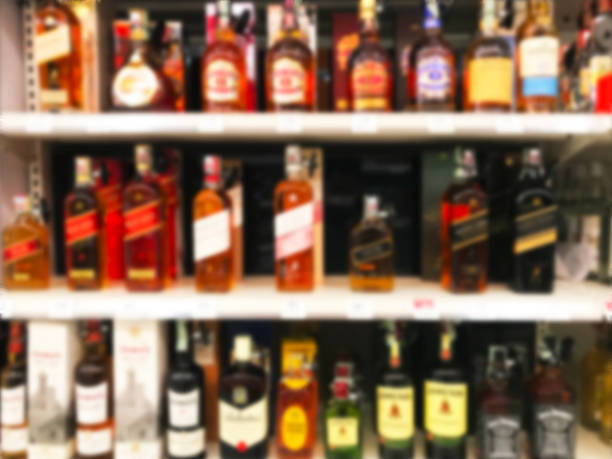 istock Wine Liquor bottle on shelf blurred background 1130058938