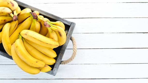 istock Fresh bananas in a wooden box. Top view. Free copy space. 1130058976