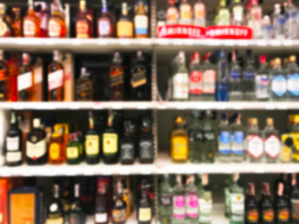 istock Wine Liquor bottle on shelf blurred background 1130059017