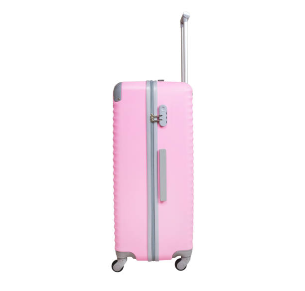 istock Pink suitcase isolated on white background. Polycarbonate suitcase isolated on white. Pink suitcase. 1130059108
