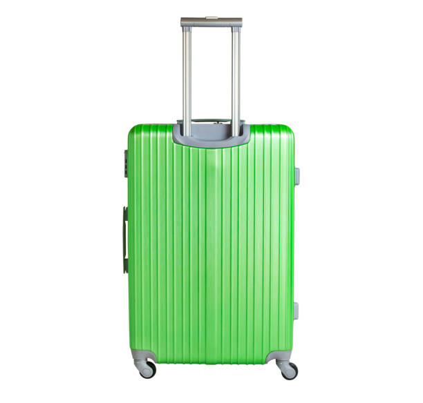 istock Green suitcase isolated on white background. Polycarbonate suitcase isolated on white. Green suitcase. 1130059116