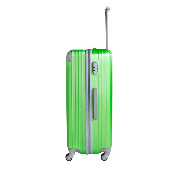 istock Green suitcase isolated on white background. Polycarbonate suitcase isolated on white. Green suitcase. 1130059117