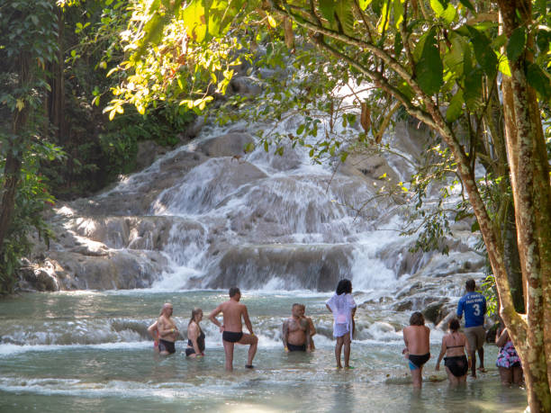 Tourists at Dunn's River Falls Ocho Rios Jamaica -4 February 2019: Tourists at Dunn's River Falls dunns river falls stock pictures, royalty-free photos & images