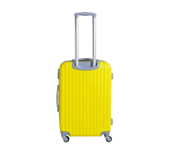 istock Yellow suitcase isolated on white background. Polycarbonate suitcase isolated on white. Yellow suitcase. 1130061302