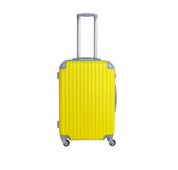 istock Yellow suitcase isolated on white background. Polycarbonate suitcase isolated on white. Yellow suitcase. 1130061304