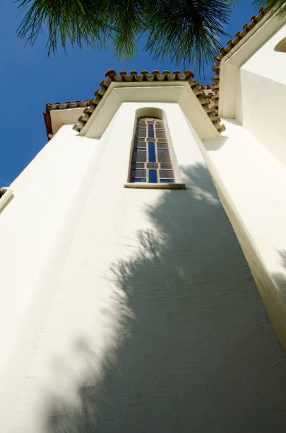 istock Orthodox white church with window and shadow on the wall 1130064025