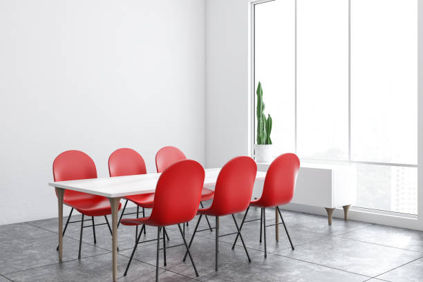 istock White dining room corner with red chairs 1130064053