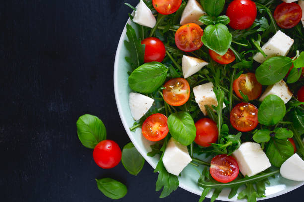 istock Vegetarian salad with cherry tomato, mozzarella and rucola 1130064662
