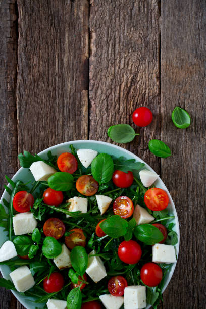 istock Vegetarian salad with cherry tomato, mozzarella and rucola 1130065291
