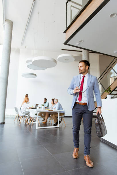 istock Handsome businessman leaving office 1130067093