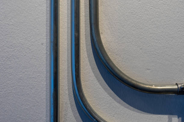 istock Metal Pipeline bending decoration on the wall 1130067862