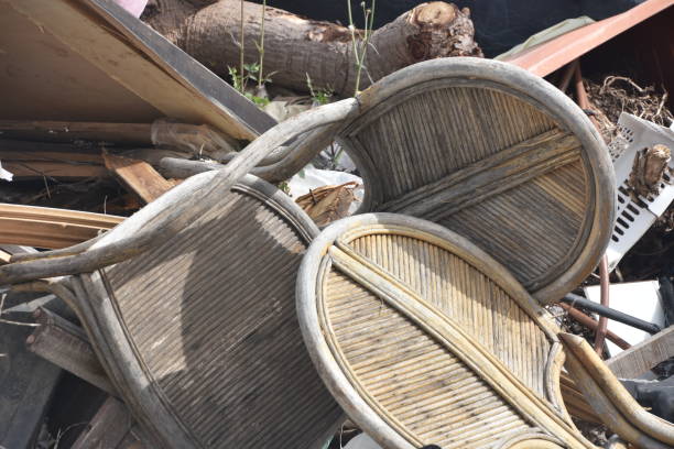 istock Vintage chairs strewn in a landfill 1130069379