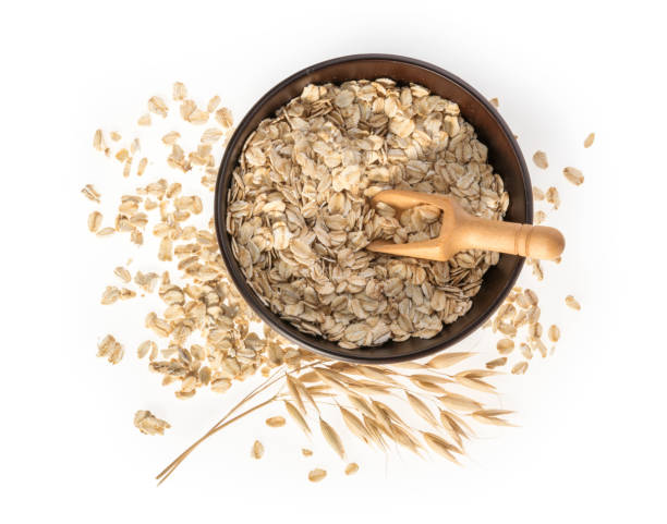 istock Rolled oats, healthy breakfast cereal oat flakes isolated on white top view 1130070431