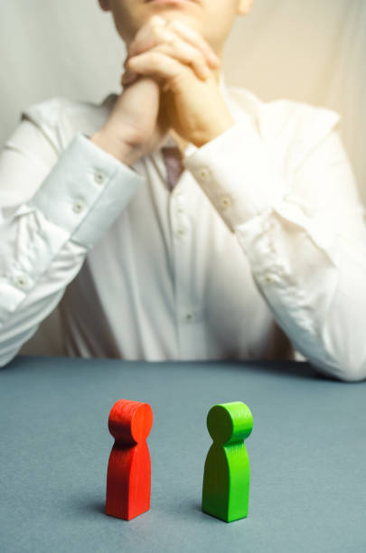 istock The arbitrator examines the conflict situation between people. Search for solutions and compromises. Court and law. Justice. Verdict. Legal support. Conflict of interest. Smoothing disputes. 1130070553