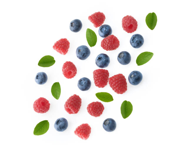 istock falling berries of raspberry and blueberry white background 1130070565