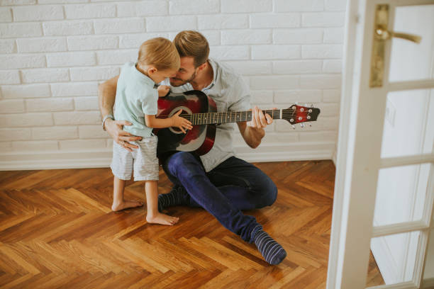 istock Father and little son with guitar 1130071859