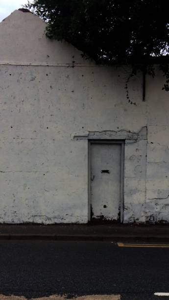 istock white wall with white door 1130073952