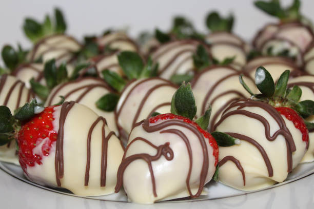 istock Homemade, hand dipped, white chocolate covered strawberries 1130076548