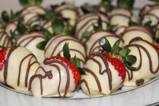 istock Homemade, hand dipped, white chocolate covered strawberries 1130076556