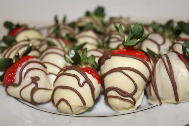 istock Homemade, hand dipped, white chocolate covered strawberries 1130076595