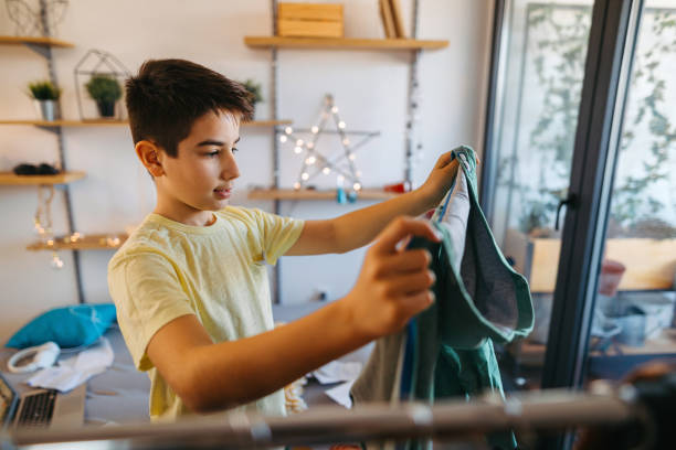 istock Teenager boy choosing clothes 1130078450