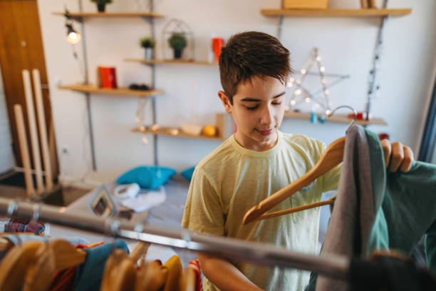 istock Teenager boy choosing clothes 1130078461