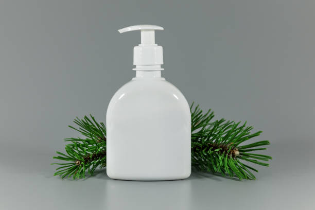 istock white blank perfume dispenser bottle with pine tree branch on gray background 1130080337