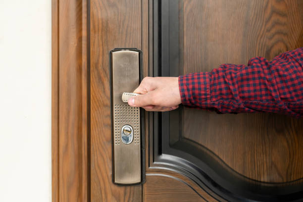 istock hand opens the door to the apartament b 1130081241