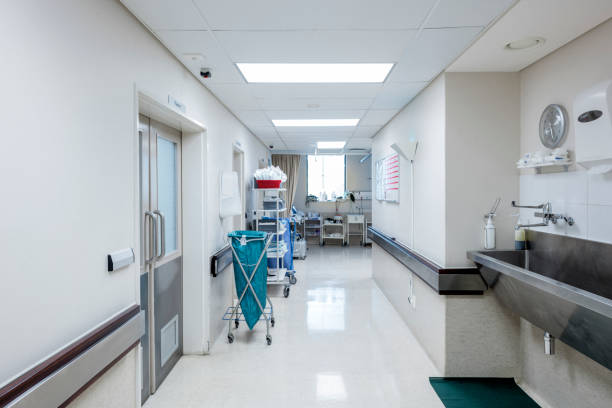 istock Clean empty illuminated corridor in hospital 1130082141