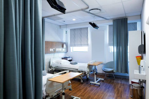 istock Rolled up towels on bed in hospital ward 1130082217