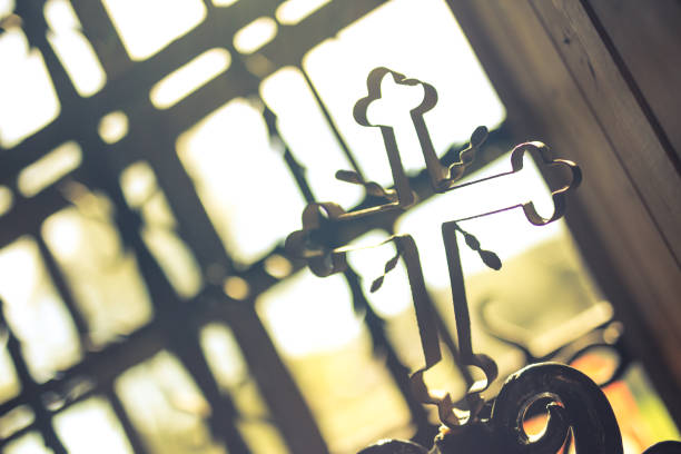 Metal cross in monastery Metal cross in monastery. Krakow in Poland złoto stock pictures, royalty-free photos & images