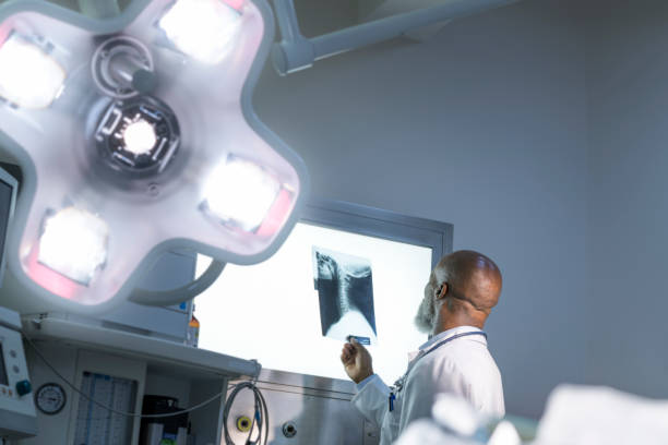 istock Male doctor analyzing x-ay scan in operating room 1130084198