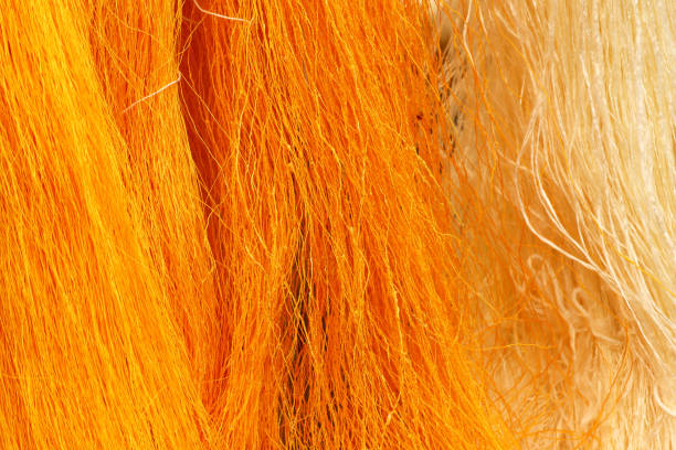 istock Golden yellow raw silk thread background 1130086189
