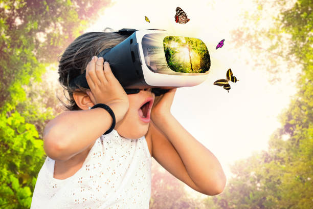 Little girl having fun with virtual reality glasses.