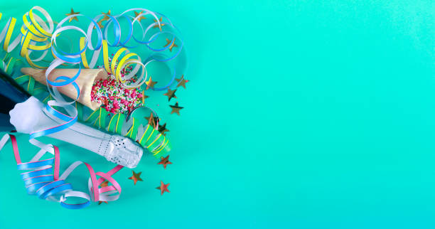 istock Celebration concept - bottle, sprinkles over green background 1130089132