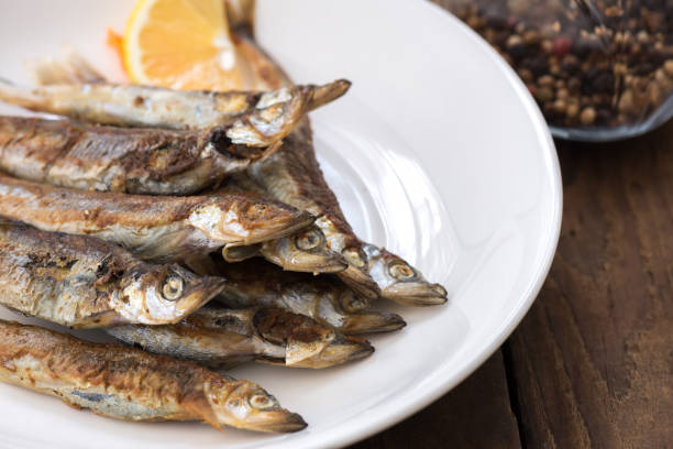 istock Grilled fish capelin or shishamo on white plate 1130089500