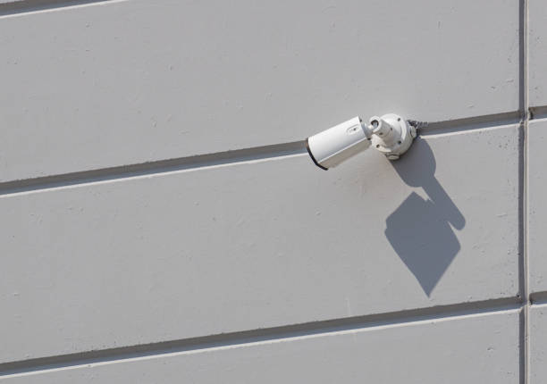 istock security camera working on the wall of a building 1130091581