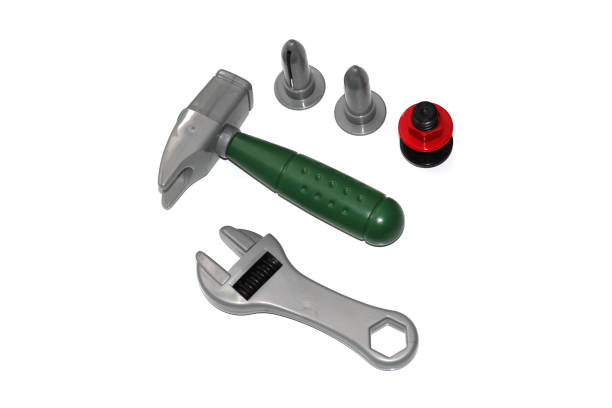istock Toy construction tools on a white background. Hammer, wrench, nails and bolt. 1130093943