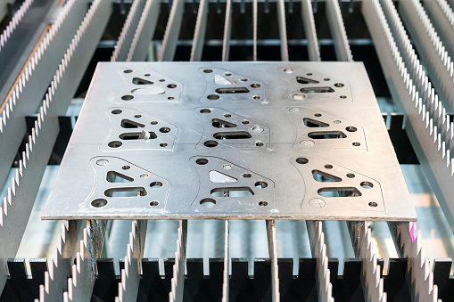 Metal sheet or plate part made from automatic and high precision laser cutting process in industrial at factory