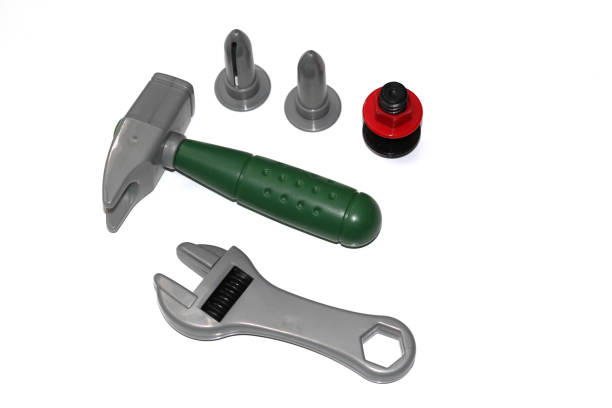istock Toy construction tools on a white background. Hammer, wrench, nails and bolt. 1130094033