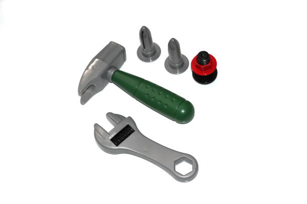 istock Toy construction tools on a white background. Hammer, wrench, nails and bolt. 1130094049