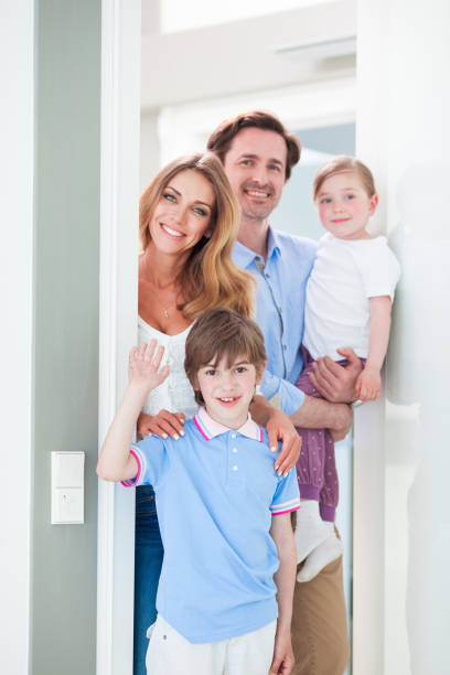 istock Happy family in doorway 1130095961
