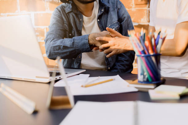 istock creative businessmans staff working with new startup project in modern interior loft.work together with laptop document and sketch paper 1130099530