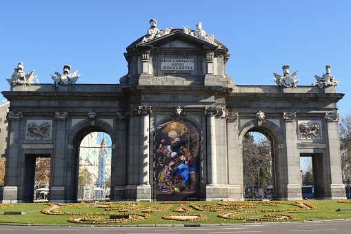 Madrid (Spain) December 30, 2018\nThe door of Alcalá, near the Retiro's park, is one of the monuments of the city of Madrid, Spain. It is one of five old gates that gave access to the city.