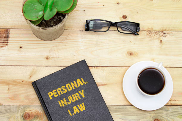 istock Personal injury law book on a table. 1130100956