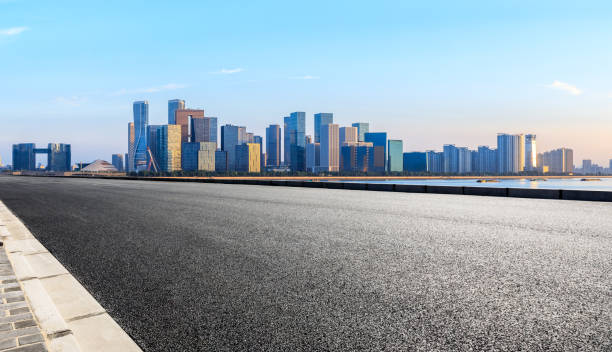 istock Asphalt road through Hangzhou business district 1130101671